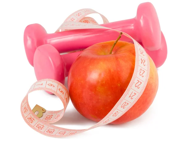 Dois halteres, maçã e fita métrica — Fotografia de Stock