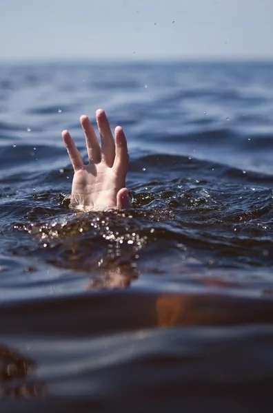 Single hand of drowning man in sea asking for help — Stock Photo ...