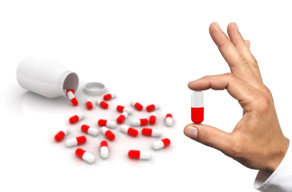 Hand with pill. — Stock Photo, Image