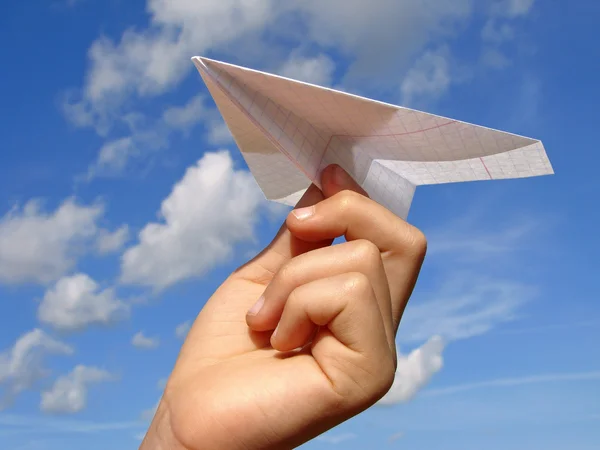 stock image Child hand with paper plane