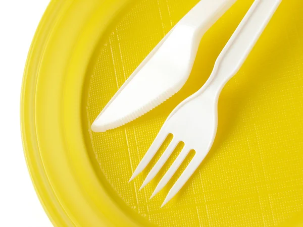 Желтая одноразовая пластина — стоковое фото