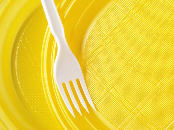 Yellow disposable plates — Stock Photo, Image