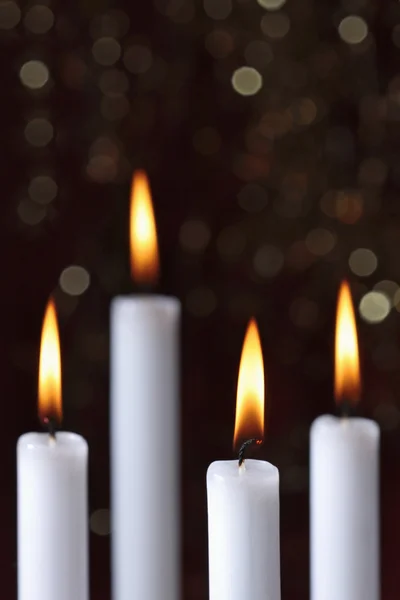 Cuatro velas encendidas —  Fotos de Stock