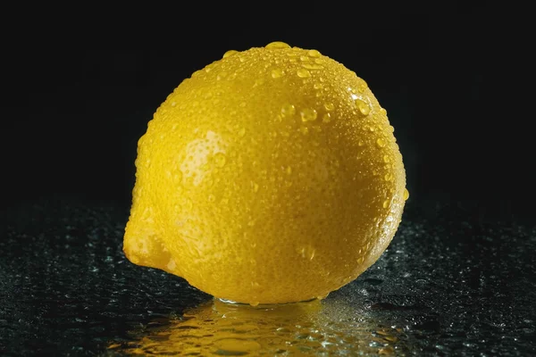 Lemon on black background — Stock Photo, Image
