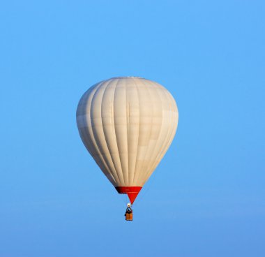 Balloon against a backdrop of blue sky clipart