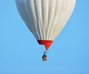 Balloon against a backdrop of blue sky clipart