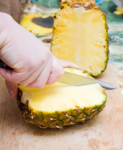 Cutting pineapple