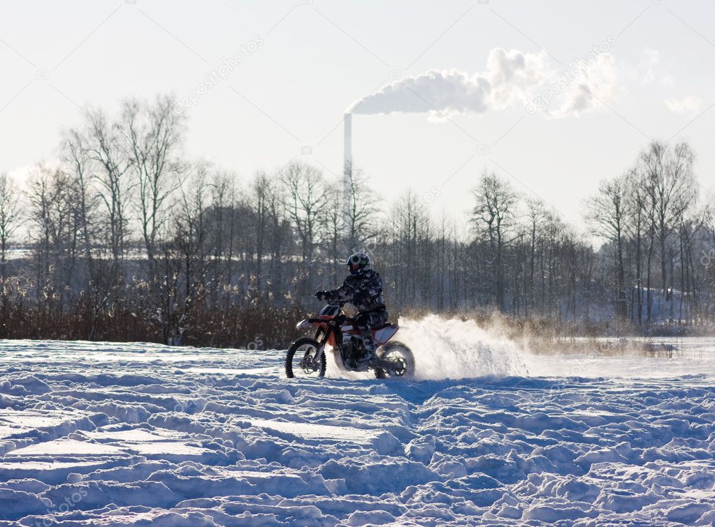 Race on a motorcycle in the winter