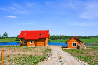 Cottage, lake, blue sky clipart