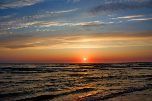 Захід сонця у морі Ліцензійні Стокові Фото