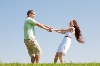 Young couple play at park