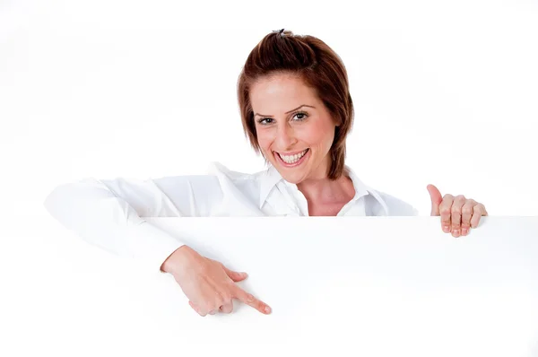 Happy young female holding a blank bill — Stock Photo, Image