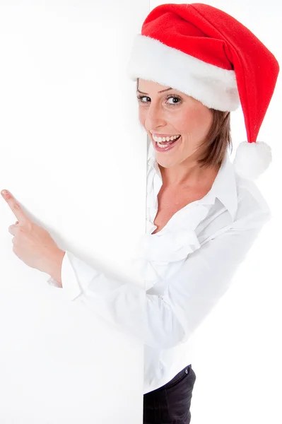 Female Santa pointing at blank bill — Stock Photo, Image