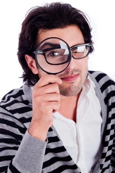 Man looking with a magnifying glass — Stock Photo, Image
