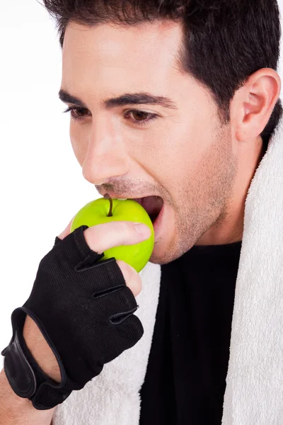 Γυμναστήριο άνδρας με πράσινο μήλο — Φωτογραφία Αρχείου