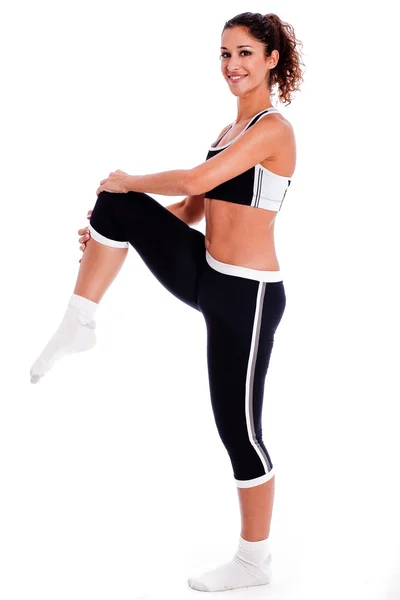 Mulher fazendo exercício no estúdio — Fotografia de Stock