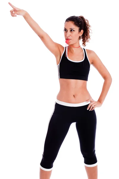 Mulher fitness apontando para cima — Fotografia de Stock