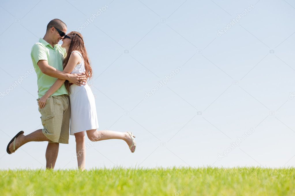 Young Couple Fooling Around On The park