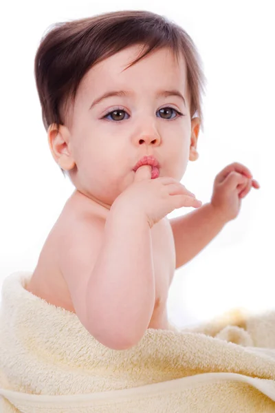 Baby met vinger in mond — Stockfoto