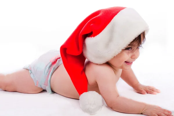 Santa baby trying to crawl — Stock Photo, Image