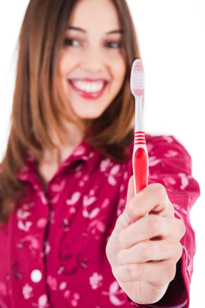 Jeunes femmes montrant la brosse à dents — Photo