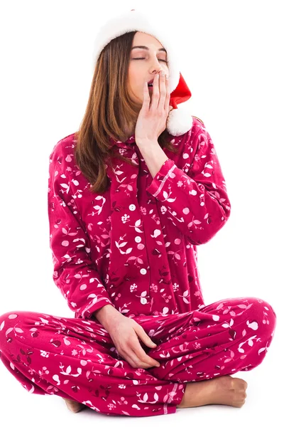 Santa girl sitting and yawning — Stock Photo, Image