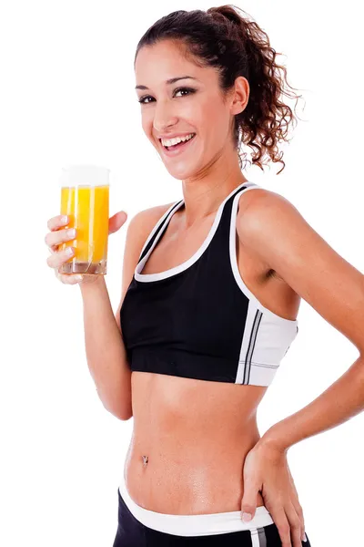 Fitness tjej med färsk juice i hand — Stockfoto