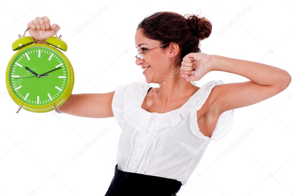 Young business woman holding clock