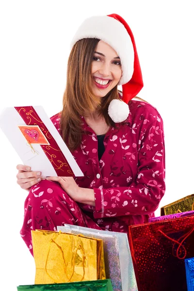 Santa girl holding a christmas card — Stock Photo, Image
