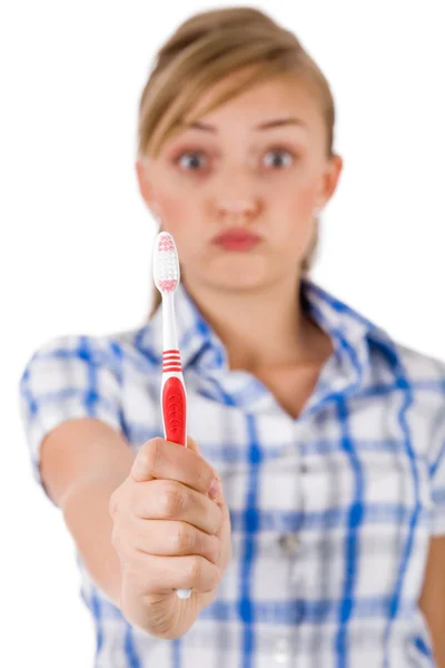 Young women showing the toothbrush — Stock Photo, Image