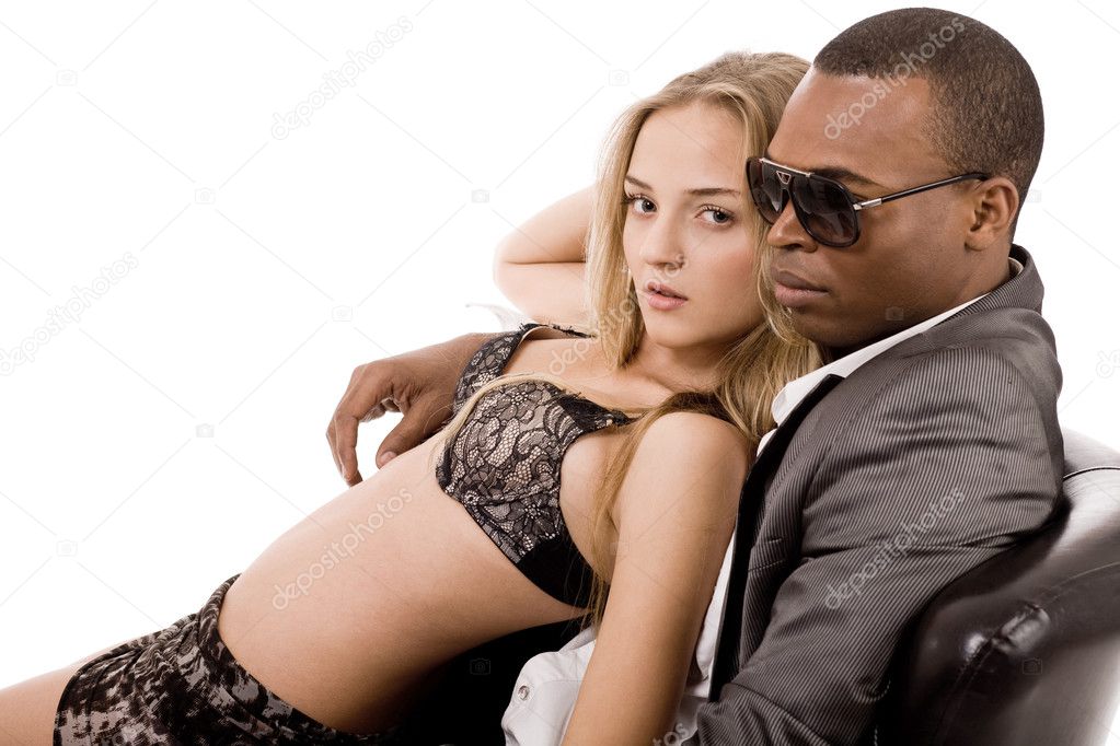 Sexy lady lying on young business man