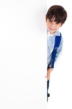 Young kid standing behind the board clipart