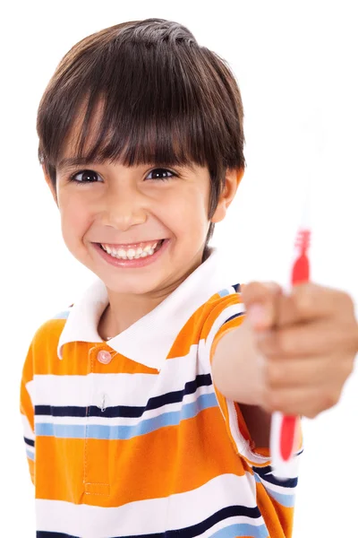 少年は歯ブラシを示す — ストック写真