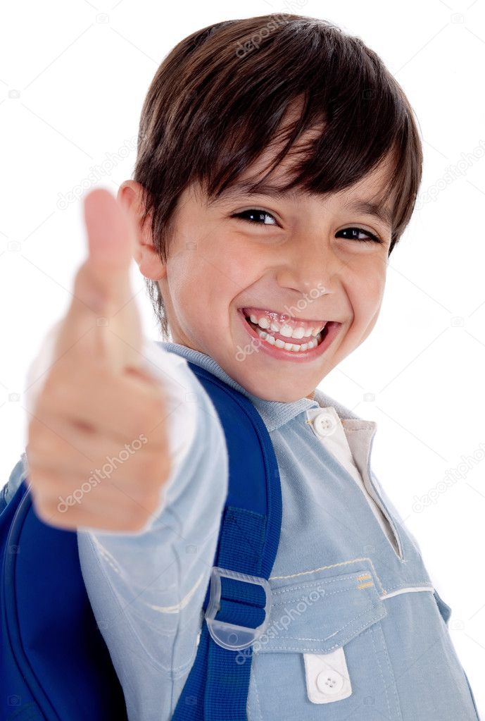 Smiling boy gives thumbs up