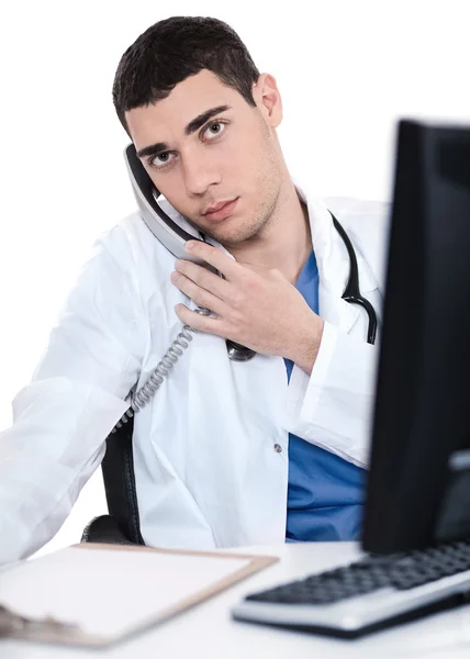 Male doctor speaking over telephone — Stock Photo, Image