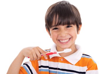 Closeup of cute kid brushing his teeth clipart