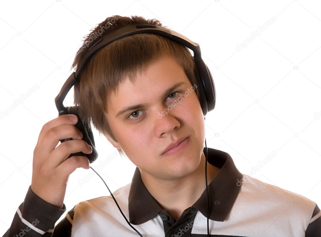 The young man in headphones listens to m