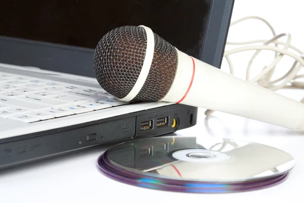 The microphone lays on notebook — Stock Photo, Image