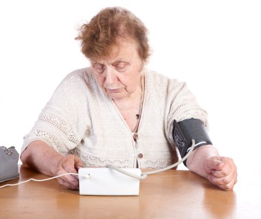 The old woman measures arterial pressure clipart