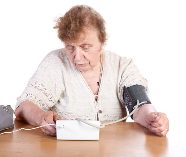 The old woman measures arterial pressure — Stock Photo, Image