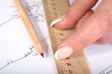 Female hands with a ruler and pencil clipart