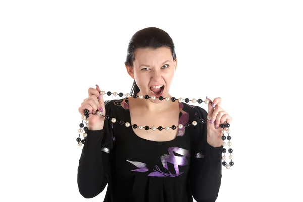 Girl with aggressive look holds beads — Stock Photo, Image