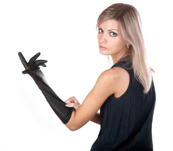 Het meisje in zwarte jurk en handschoenen — Stockfoto