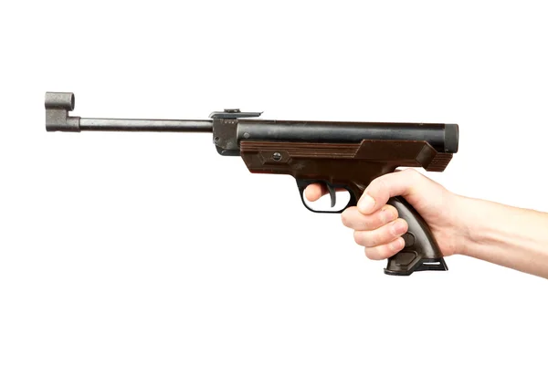 The man's holds pneumatic pistol — Stock Photo, Image