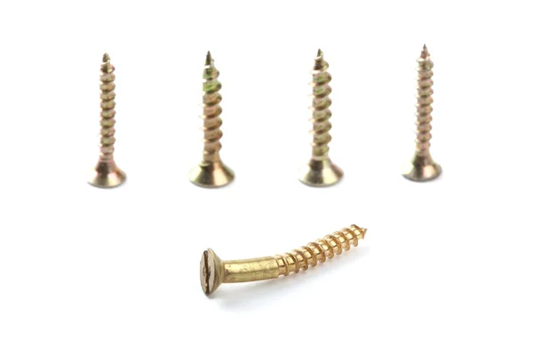 Line of golden screws — 图库照片