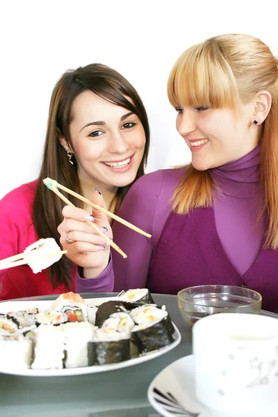 Womans eating salmon sushi — Stock Photo, Image