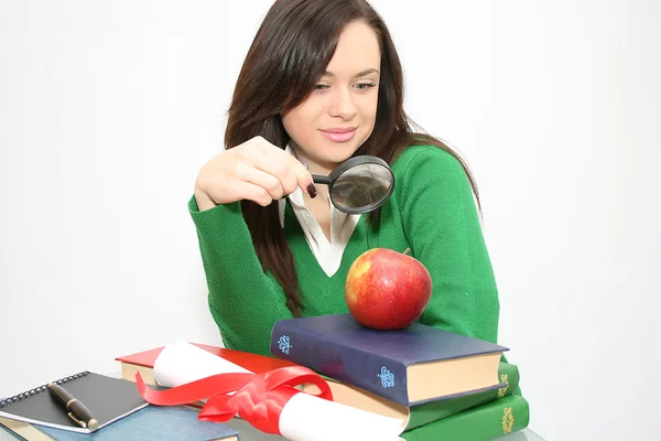 Young studentlooking through loupe — Stock Photo, Image
