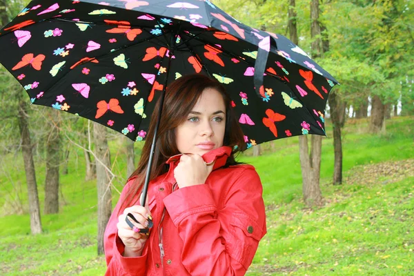 Woman holding a umbrella — Stock Photo, Image