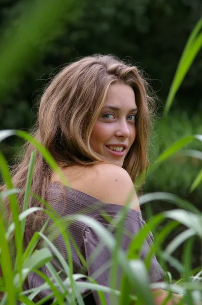 stock image Girl through the grass