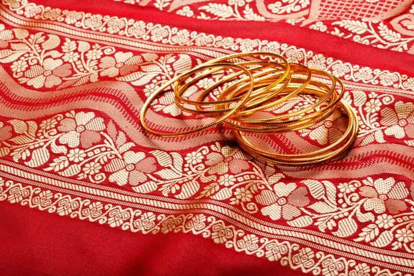Indian sari with golden bangles — Stock Photo, Image